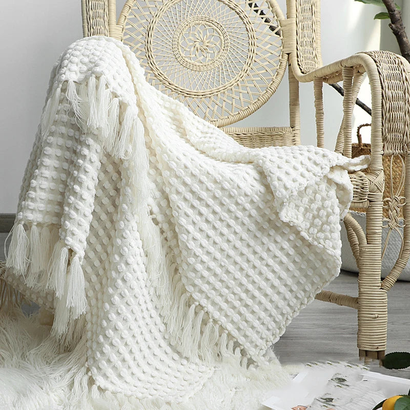 Knitted bohemian fringed blanket