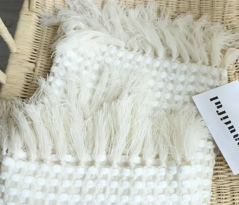 Knitted bohemian fringed blanket