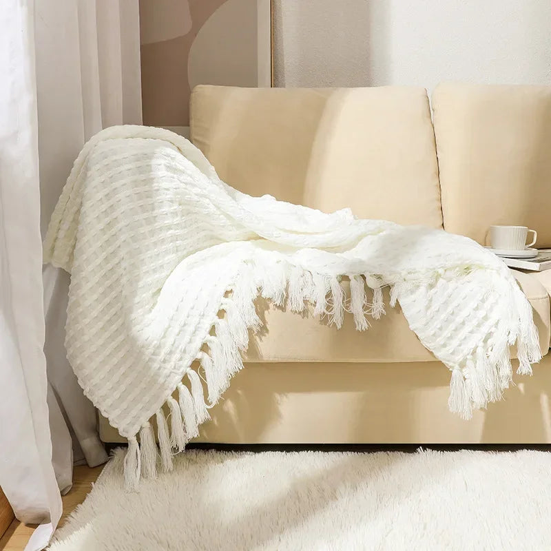 Knitted bohemian fringed blanket