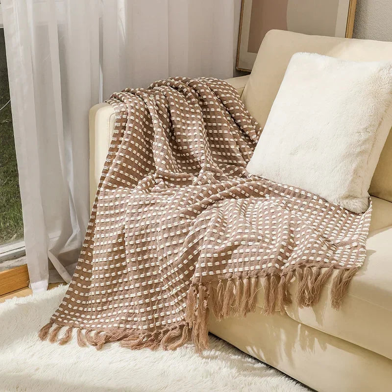 Knitted bohemian fringed blanket
