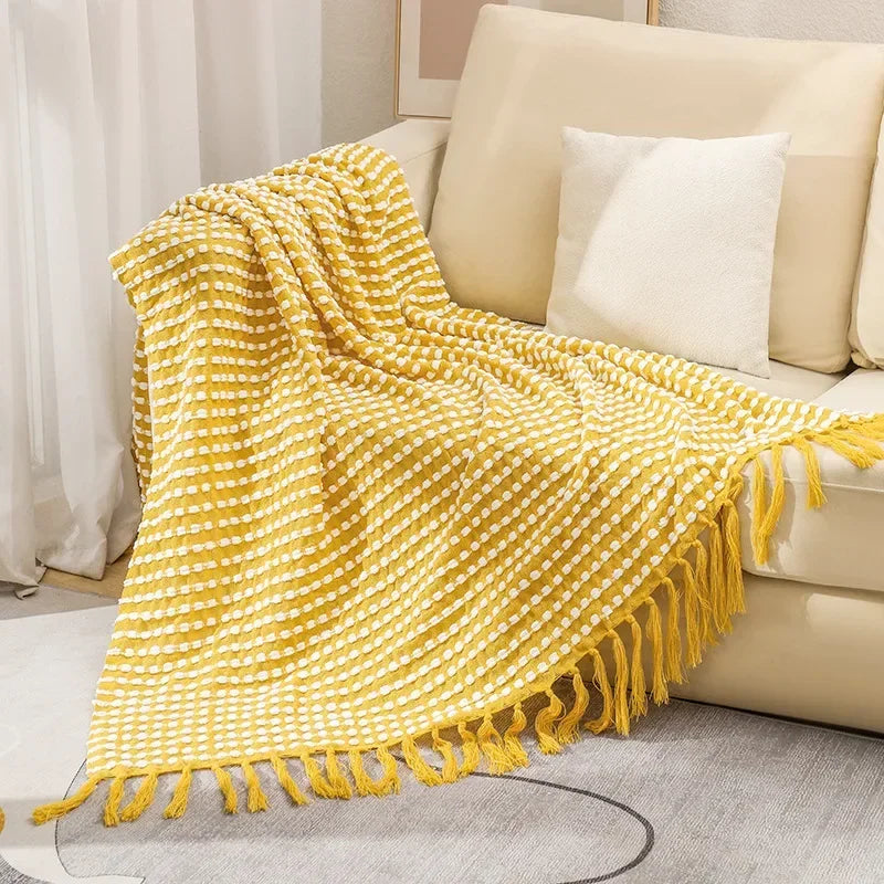 Knitted bohemian fringed blanket