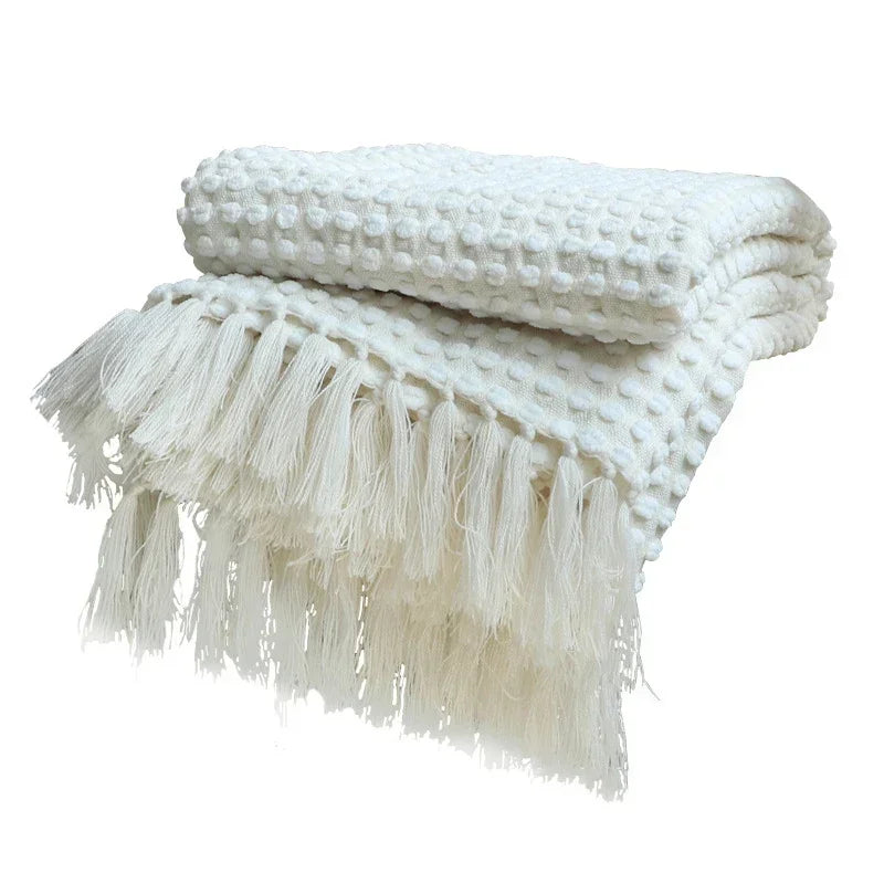 Knitted bohemian fringed blanket